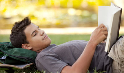 student reading outside