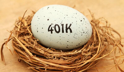 A speckled egg labeled "401K" rests in a bird's nest made of dried straw on a wooden surface, symbolizing the importance of planning for senior benefits.