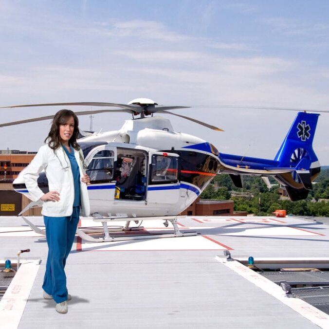A medical professional stands on a rooftop helipad with a blue and white emergency helicopter in the background, ready to embark on her next life-saving mission in FL.