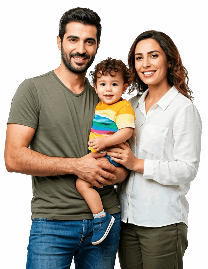 A man and woman stand close together, smiling at the camera, while the man holds a young child wearing a colorful striped shirt and shorts.